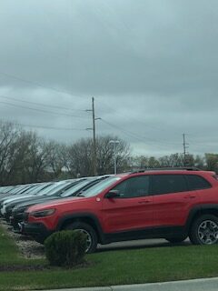 A row of cars in a parking lot.